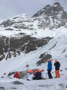 People on mountain in baczac beanies