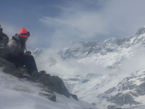 Person on mountain in baczac beanies