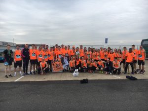 large group of people in baczac t-shirts