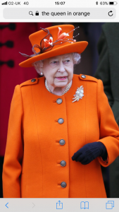 The queen wearing orange